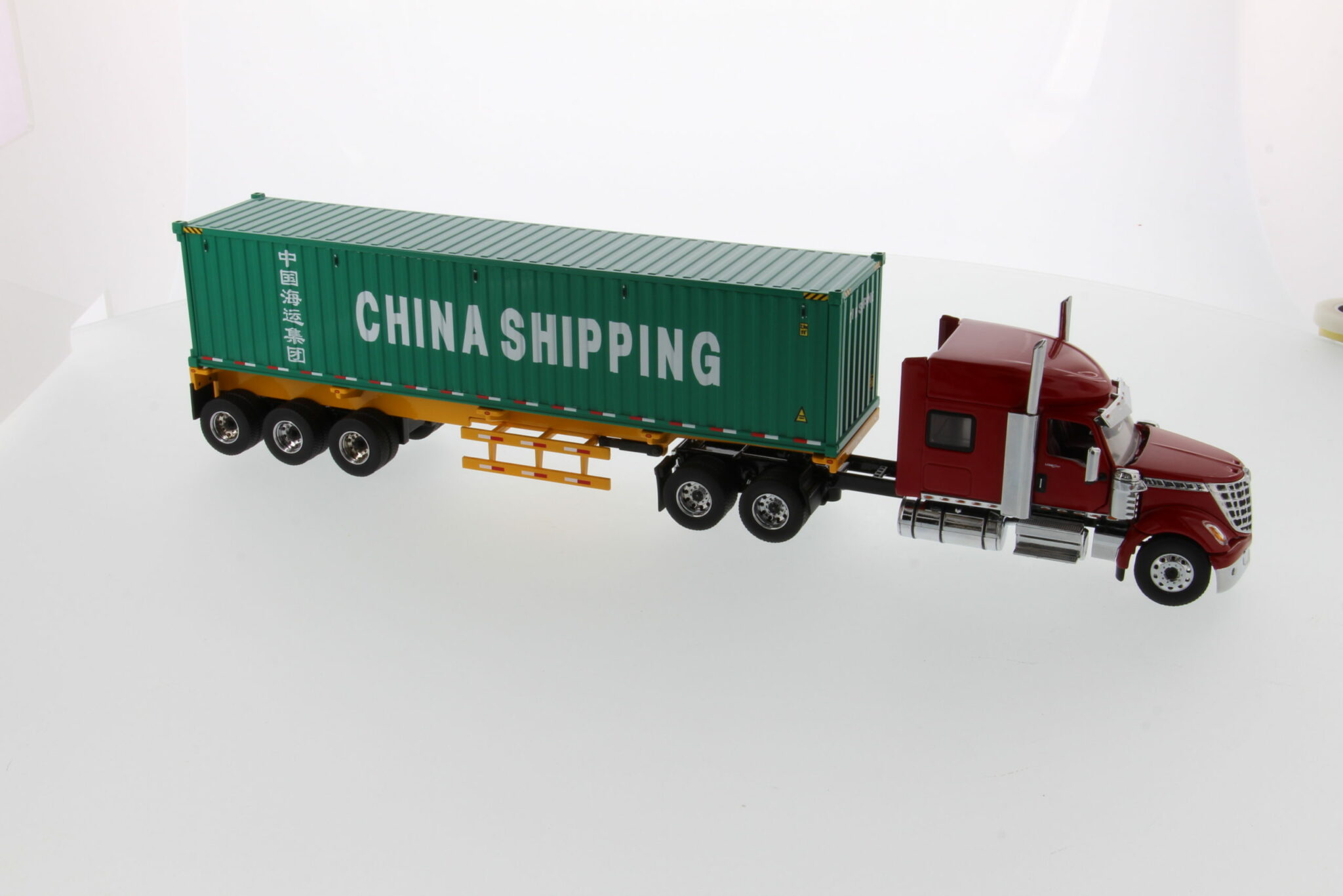 International 1:50 Diecast LoneStar Sleeper Cab with Skeleton Trailer and  40' Dry Goods Sea Container - Red tractor + Safety yellow skeleton + China 